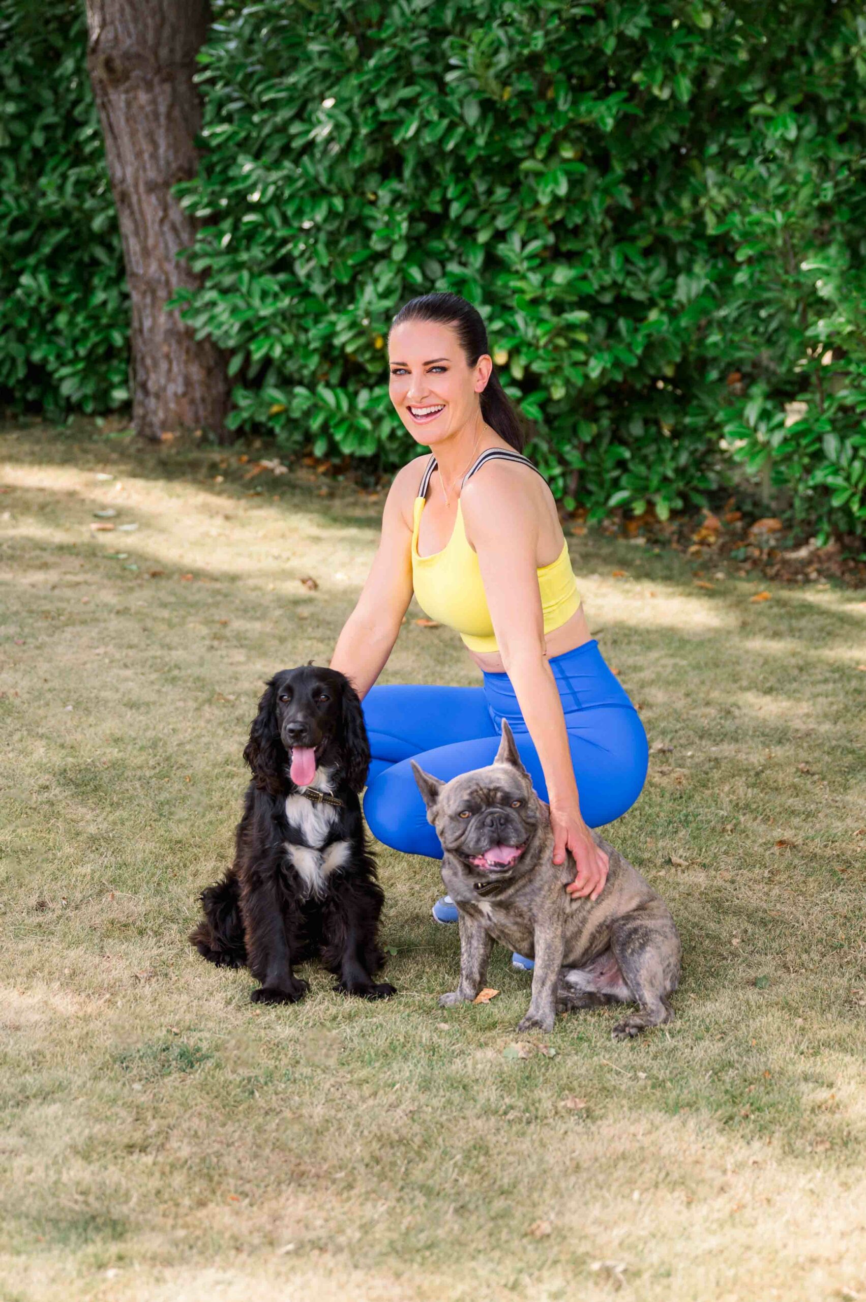 Picture of TV presenter Kirsty Gallacher outdoors with her dogs
